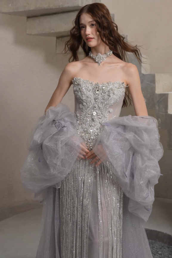 Beaded wedding gown with crystal fringe and dramatic tulle train