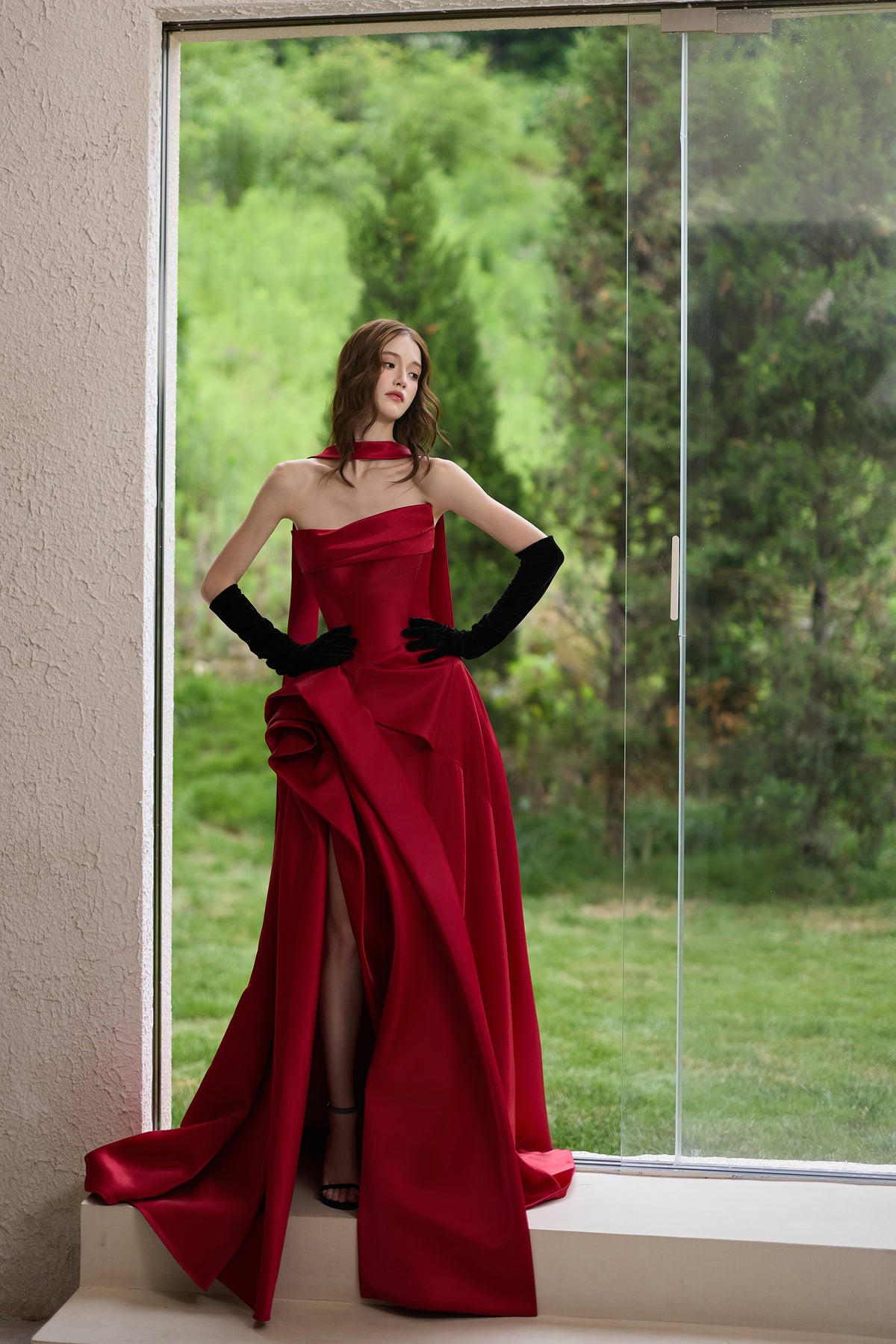 Burgundy strapless evening gown with matching scarf, black velvet gloves, high slit and long train