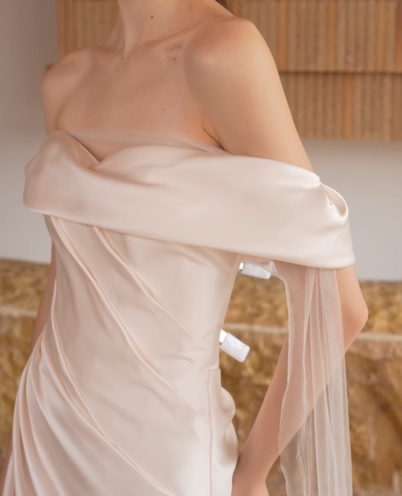 Close View of satin bodice and off-the-shoulder neckline on a minimalist wedding dress