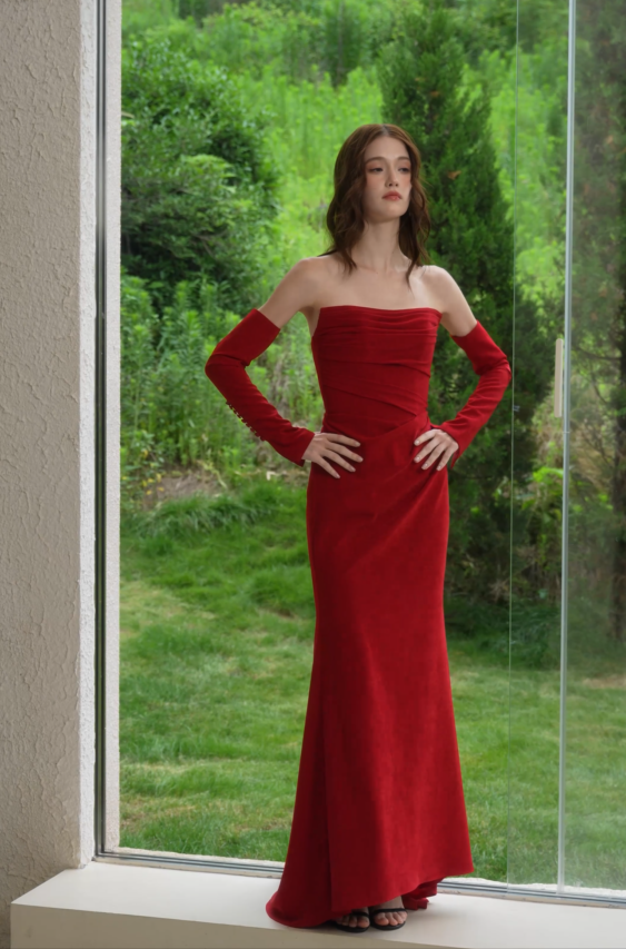 Elegant red velvet strapless evening gown with ruched bodice, fitted silhouette and matching long gloves