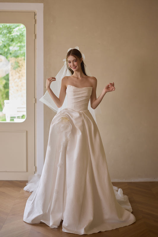 Floral satin strapless A-line wedding dress with floral waist detail and sweeping train