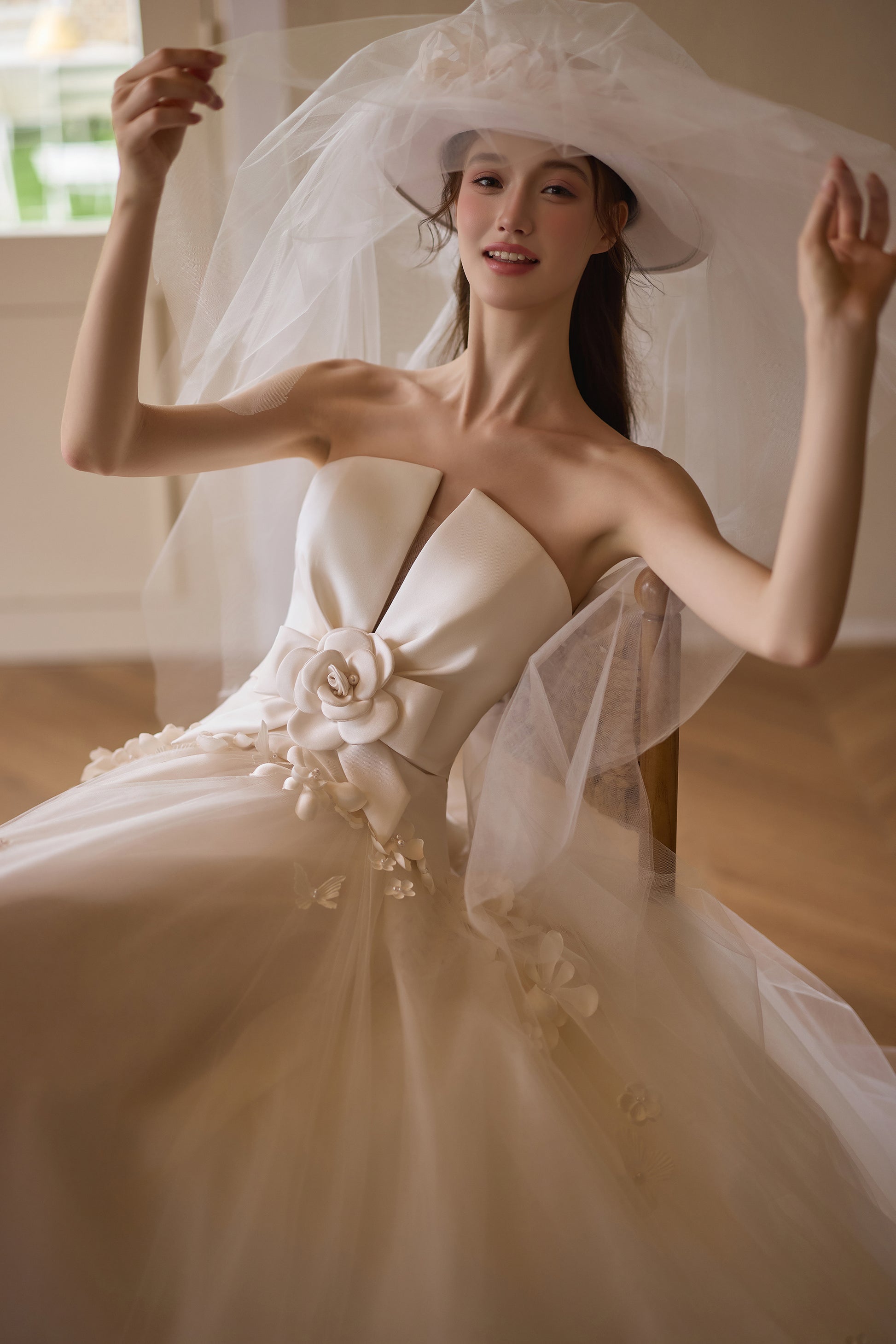 Floral strapless A-line wedding dress with 3D flower waist detail and full skirt