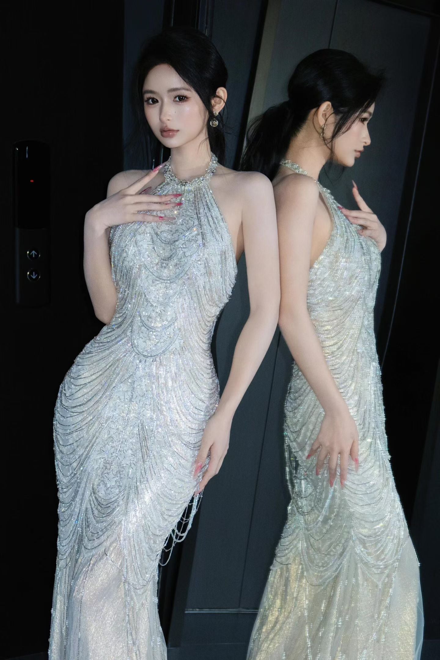 Front view of a glamorous beaded halter mermaid wedding gown with crystal embellishments