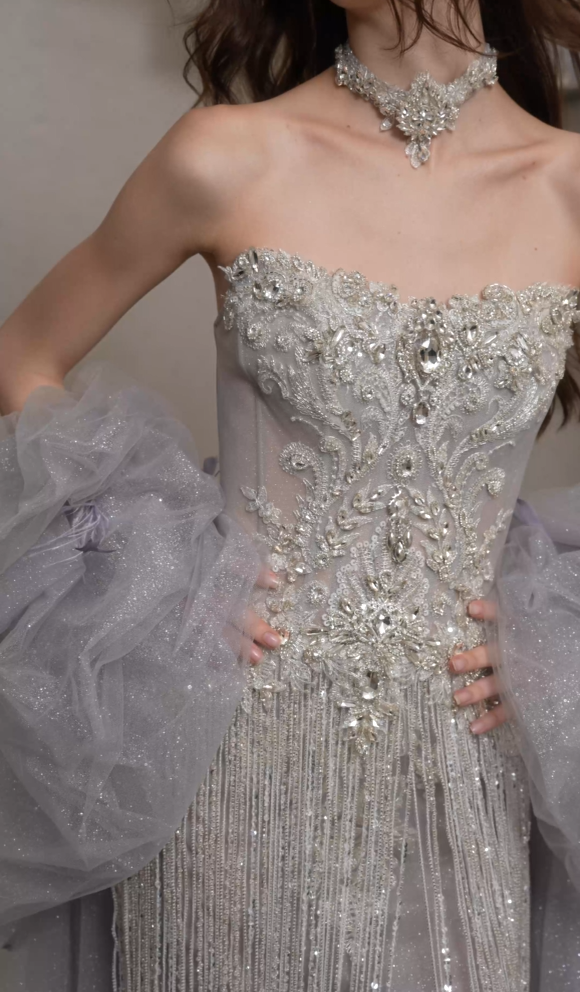 Intricate crystal and floral beadwork on a strapless wedding dress bodice
