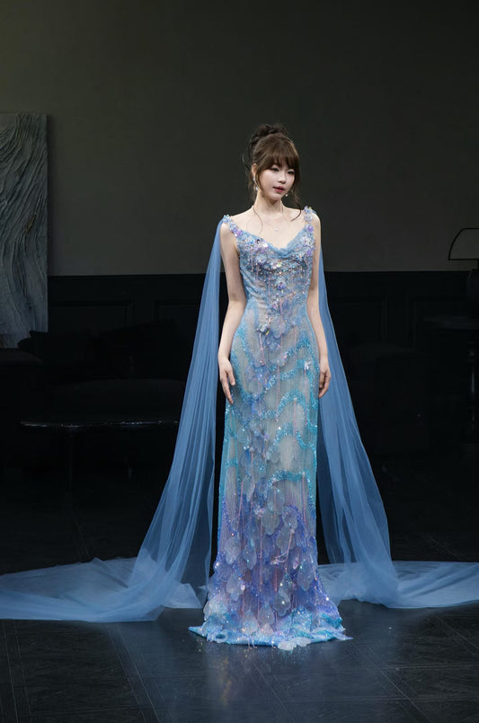 Luxury ice blue crystal beaded sheath evening gown with iridescent 3D embellishments and long sheer tulle cape