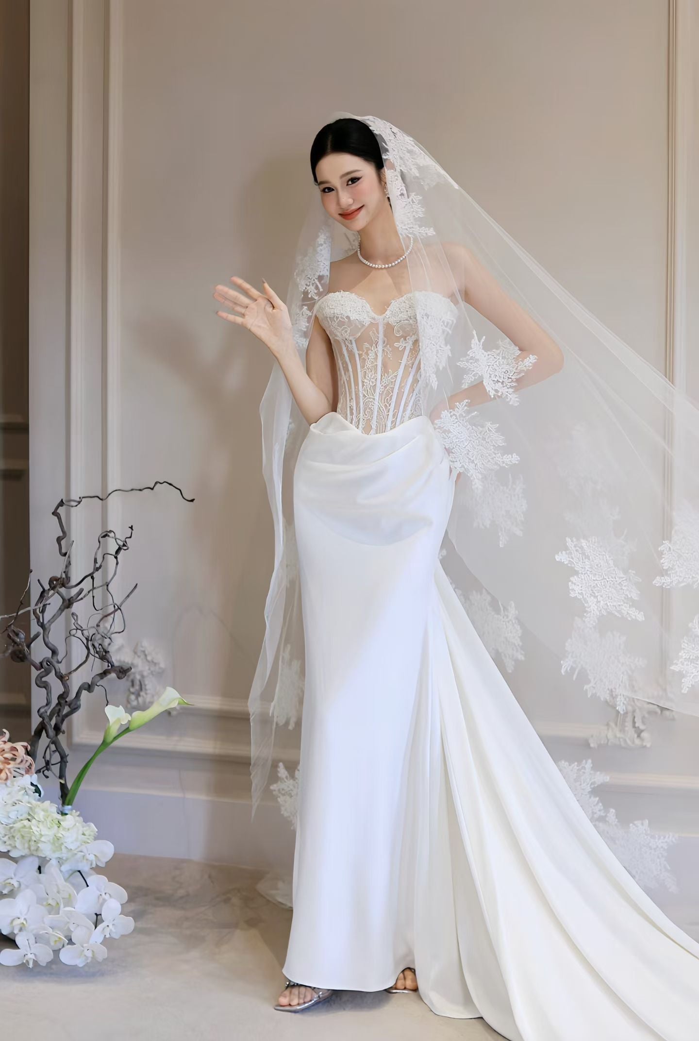 Luxury lace corset sheath wedding dress with sweetheart neckline, sheer boned bodice, draped skirt and Cathedral Veil