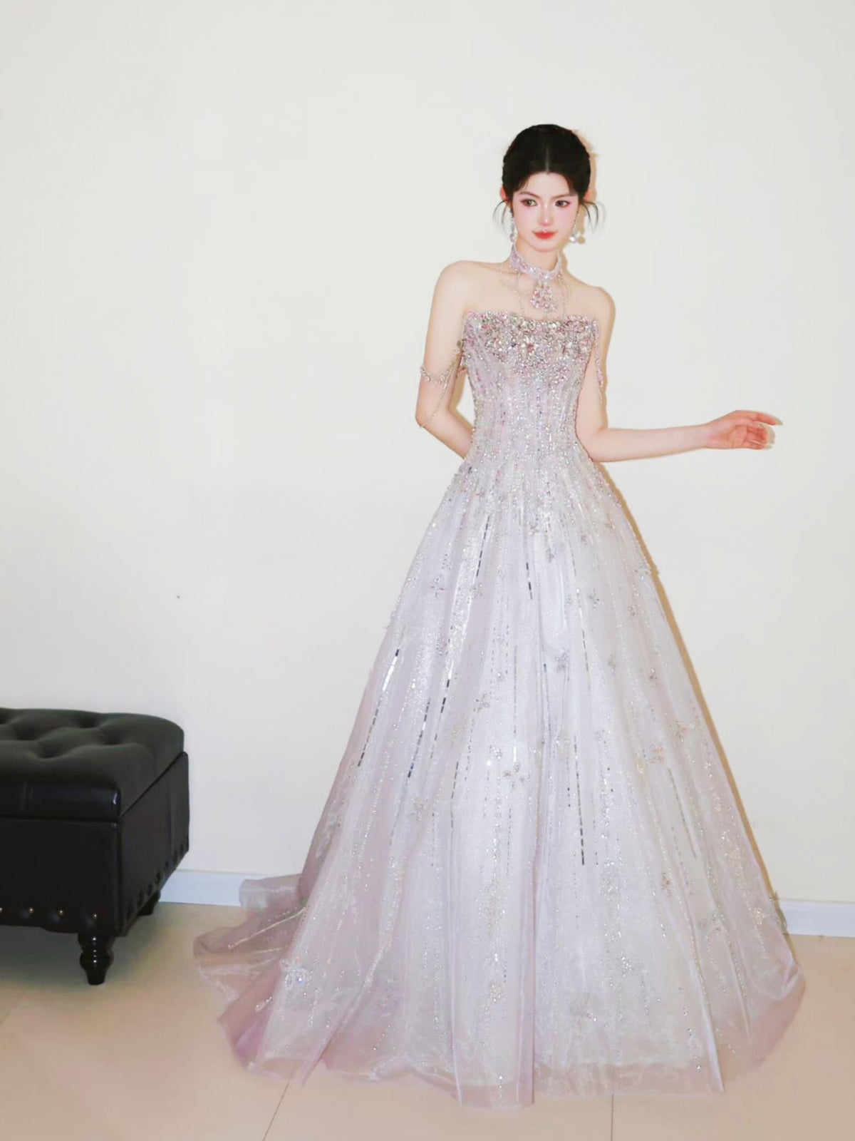 Luxury sparkly crystal beaded ball gown with strapless corset bodice and voluminous blush tulle skirt