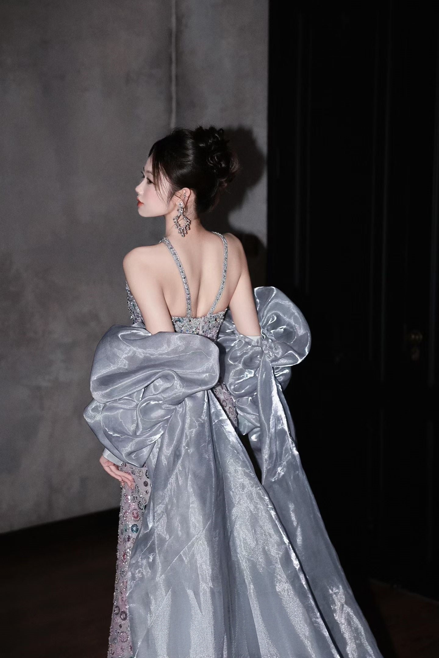 Open back beaded halter wedding gown with oversized detachable silver organza sleeves