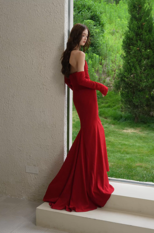 Red velvet strapless evening gown with long gloves and elegant sweep train, side and back view