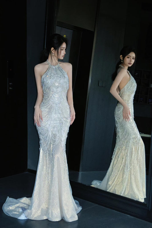 Sparkly beaded halter mermaid wedding dress with open back and flowing train