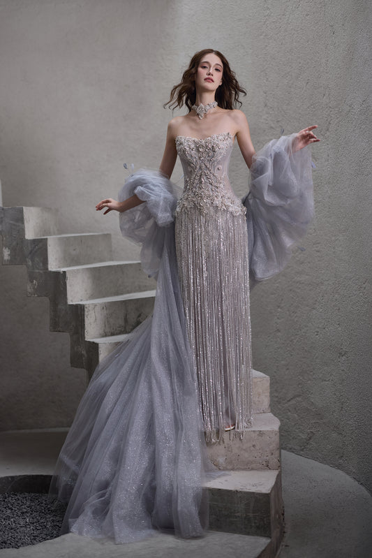 Sparkly beaded strapless wedding dress with detachable sheer sleeves and glitter train