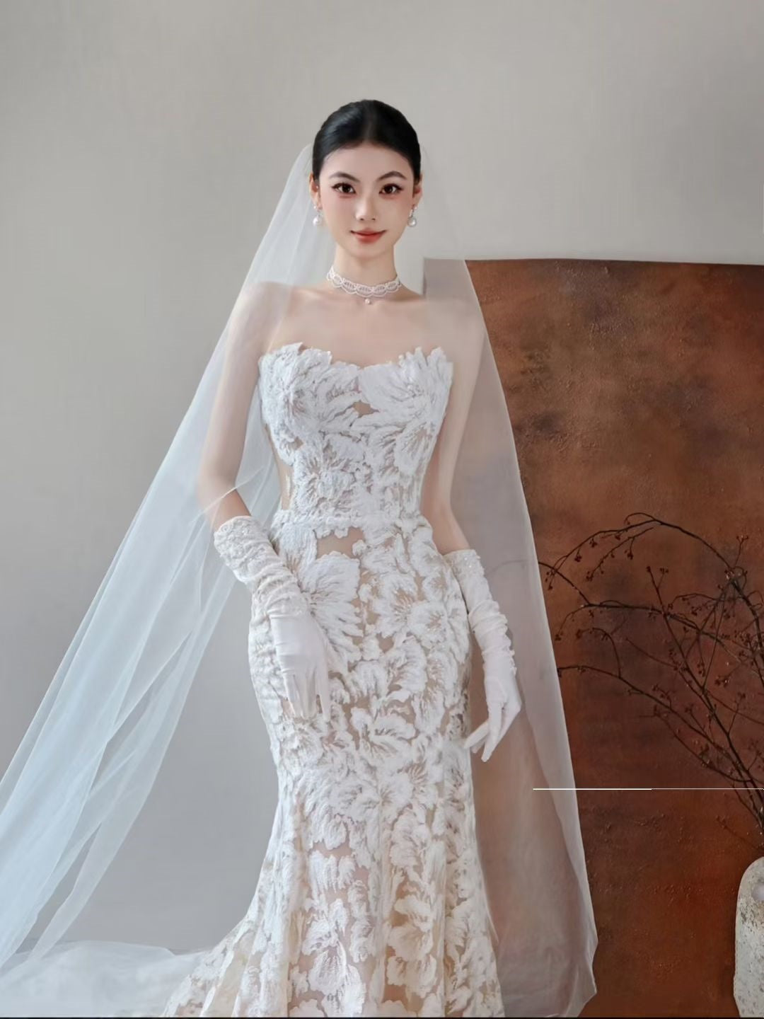 Strapless floral jacquard mermaid wedding dress with long train and bridal veil