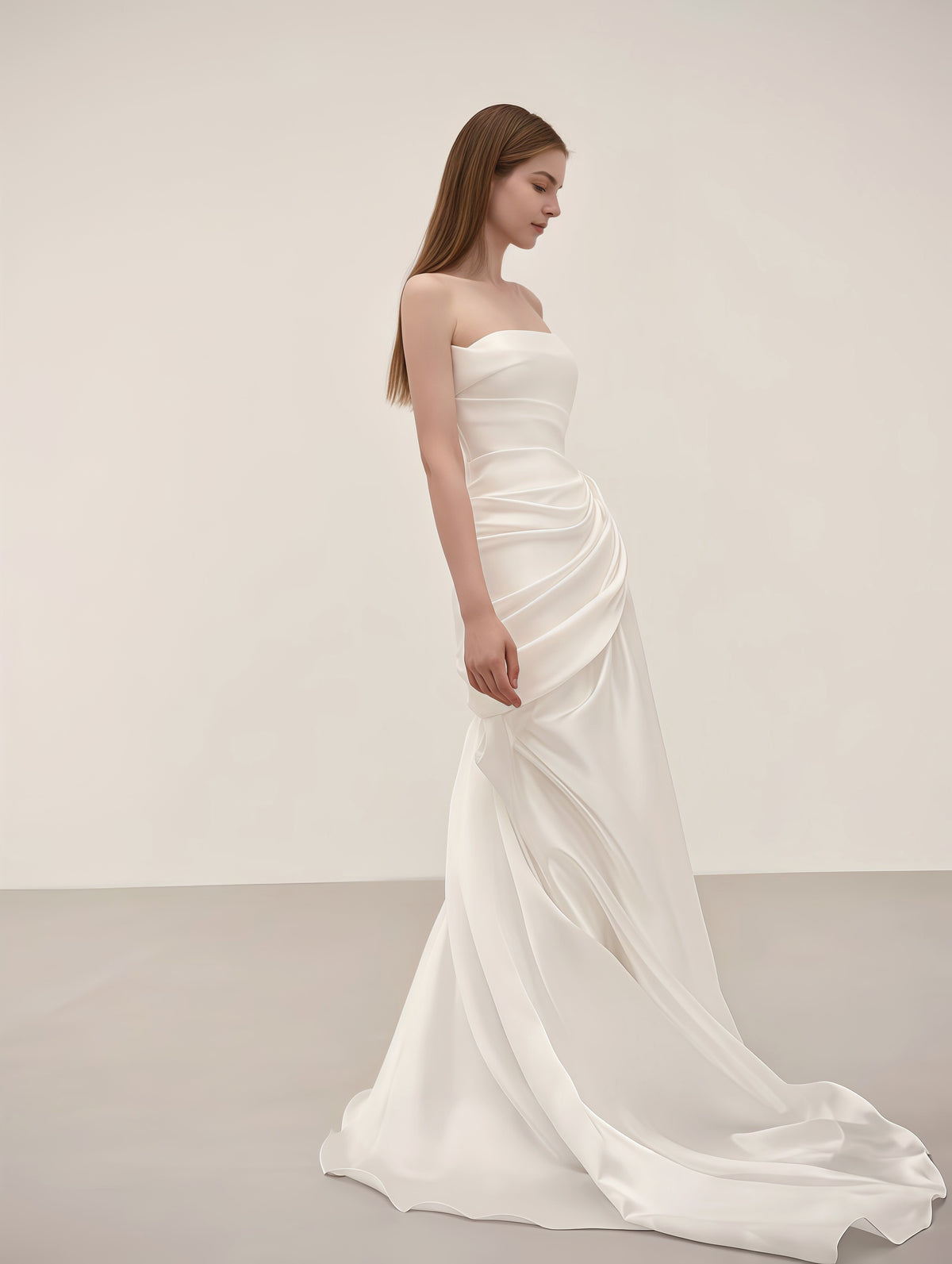 Flowing satin mermaid skirt and sweep train on a minimalist wedding dress