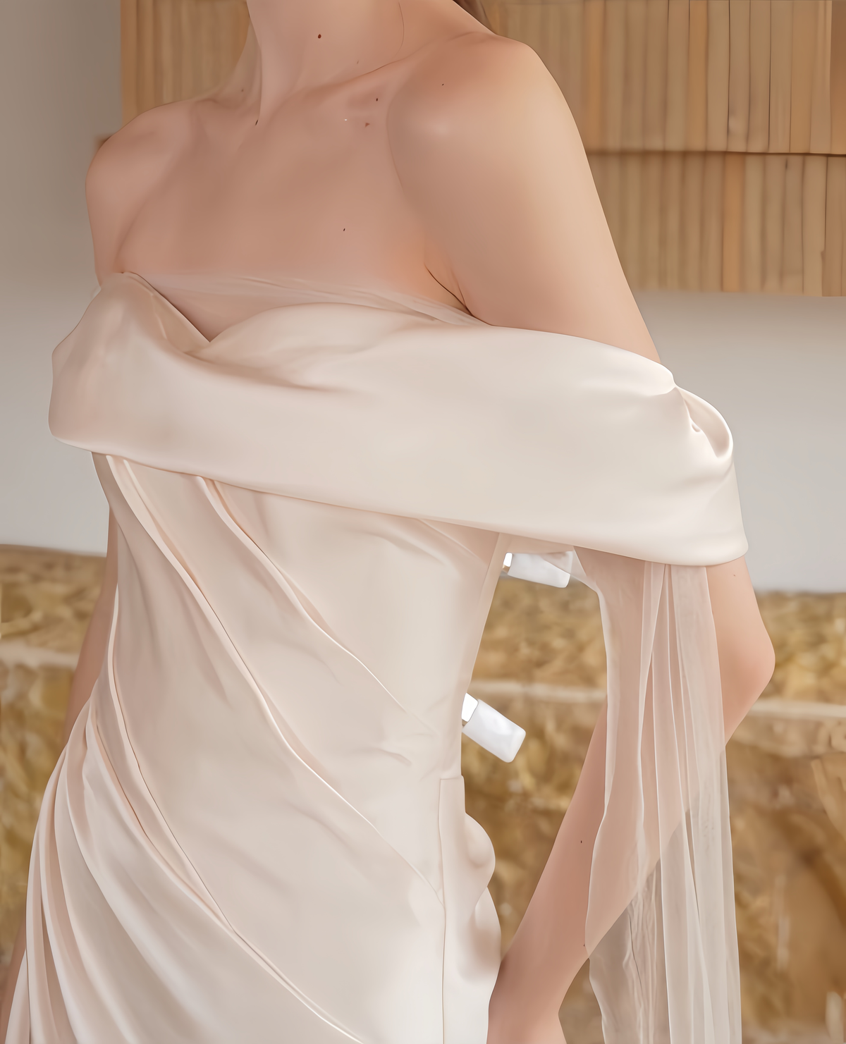 Close View of satin bodice and off-the-shoulder neckline on a minimalist wedding dress