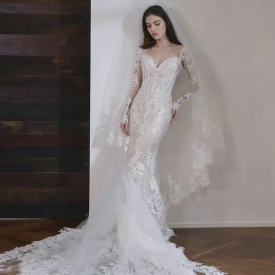 Ivory lace mermaid wedding dress with long sleeves and cathedral length train